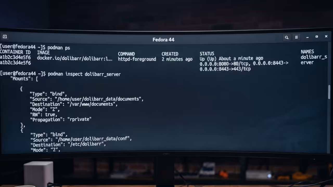 Fedora 44 terminal showing podman ps output